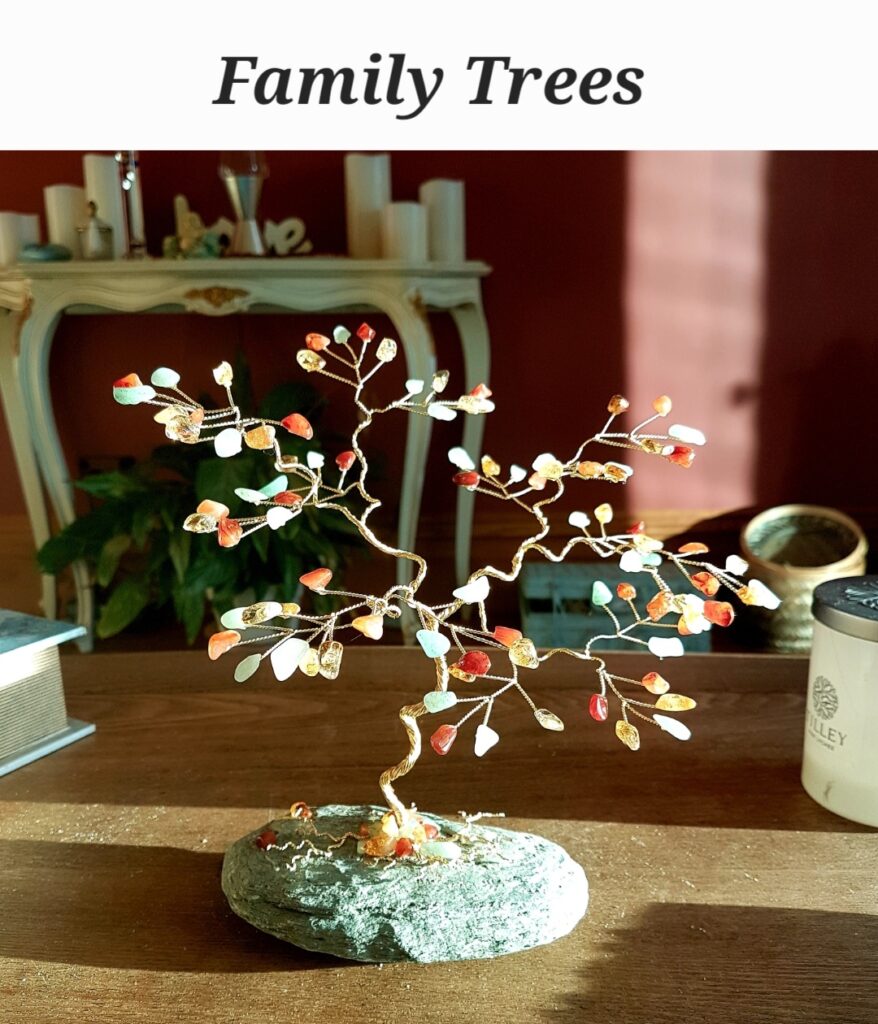 family tree 1 Wire bonsai sculpture with multicolored gemstone beads on a stone base.