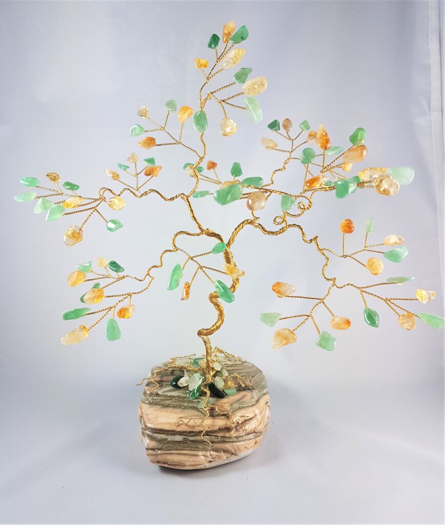large gw yb cit ave fav Decorative wire tree sculpture adorned with green and amber stones on a stacked wooden base